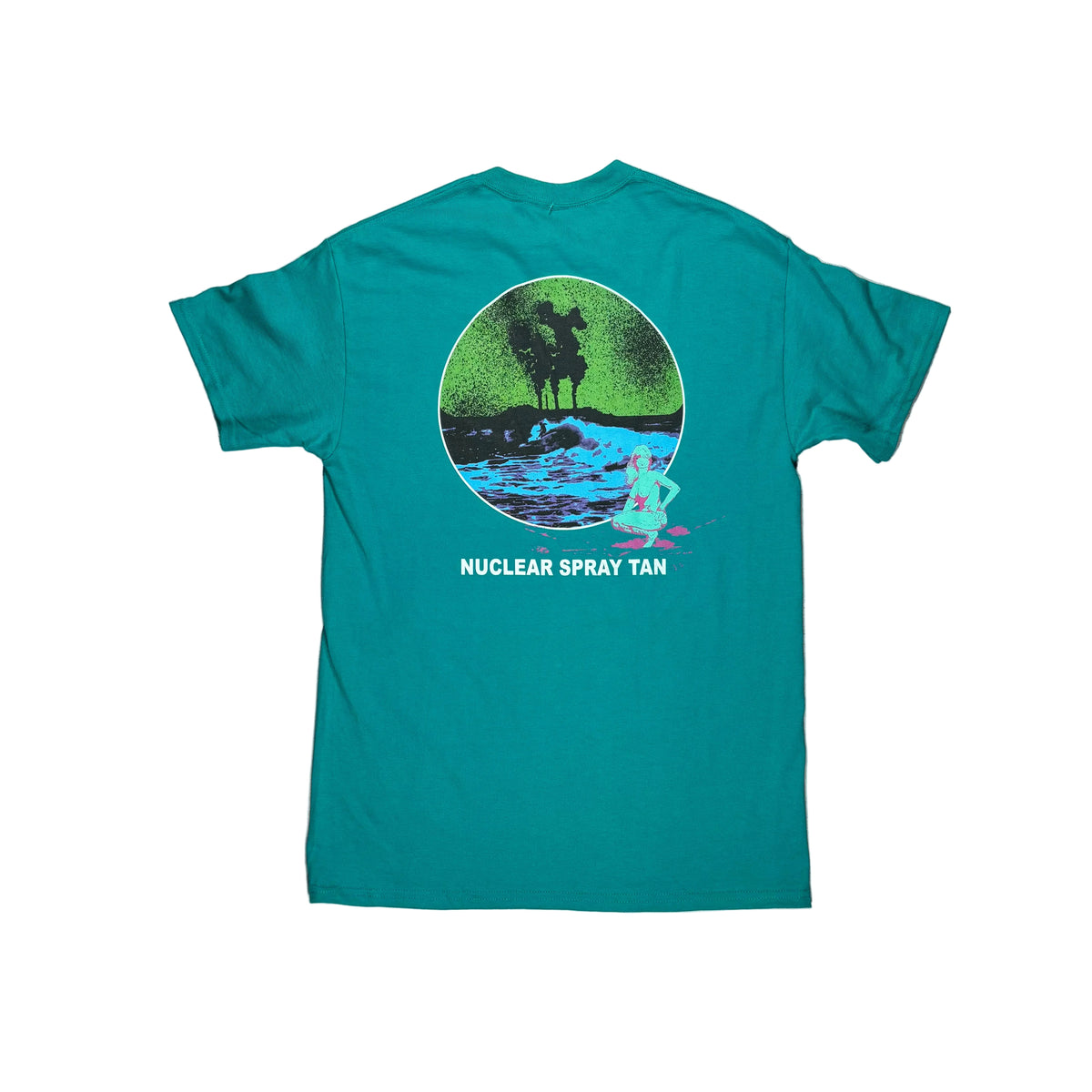 A teal t-shirt laid flat on a white surface, showing the back side with a circular graphic of an ocean landscape and the text 'NUCLEAR SPRAY TAN'.