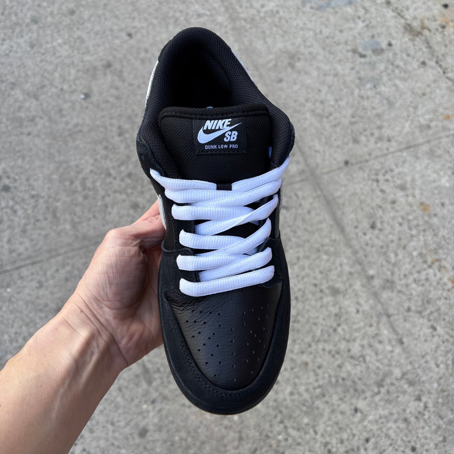 top down view of black/white nike sb dunk low