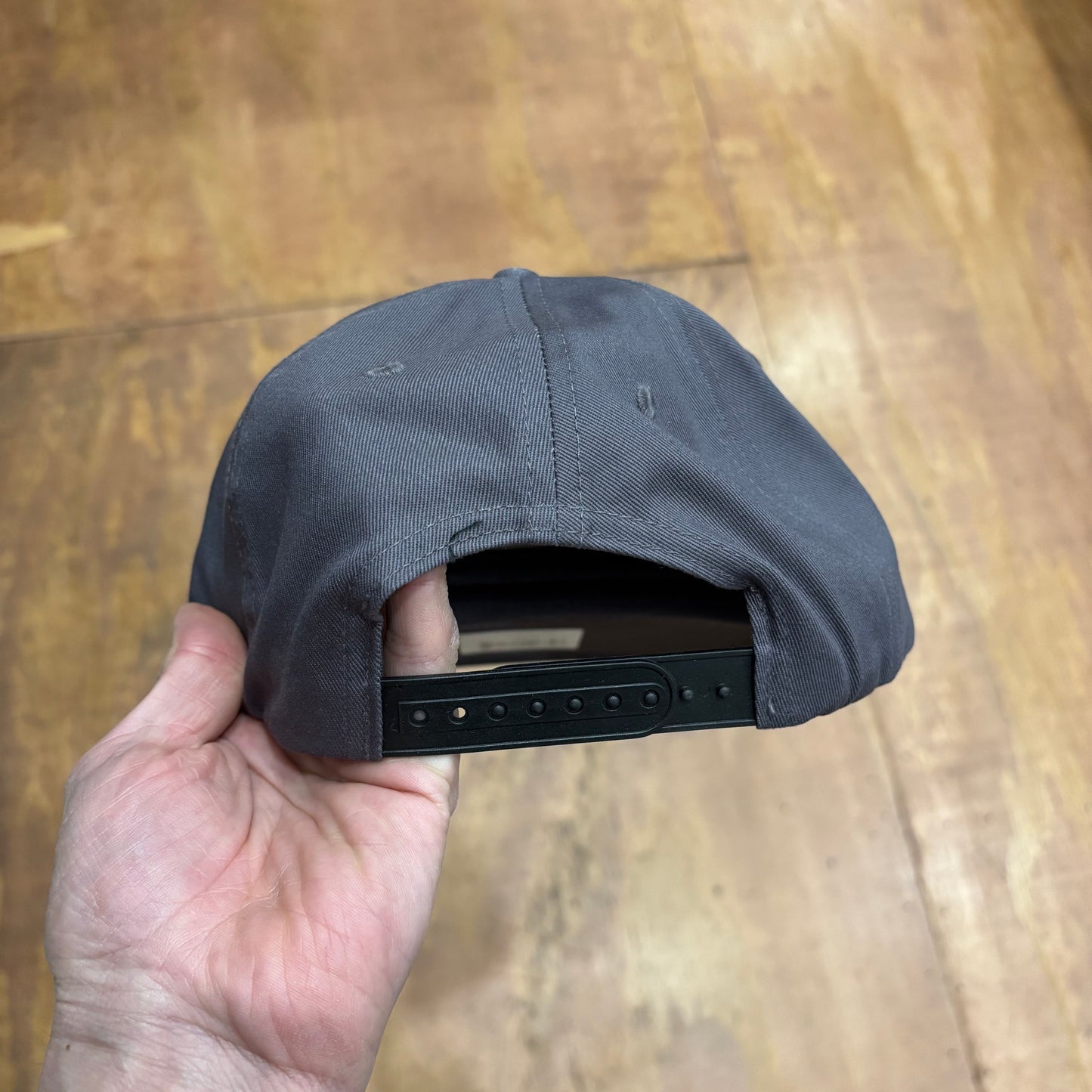 rear view of grey snapback cap
