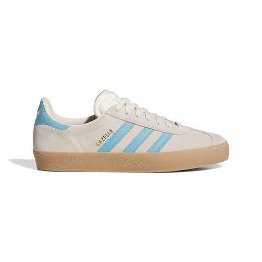 side view of white, blue and gum sole shoe