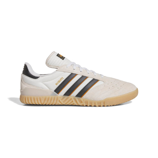 side view of white suede lowtop soccer style skateboard shoe