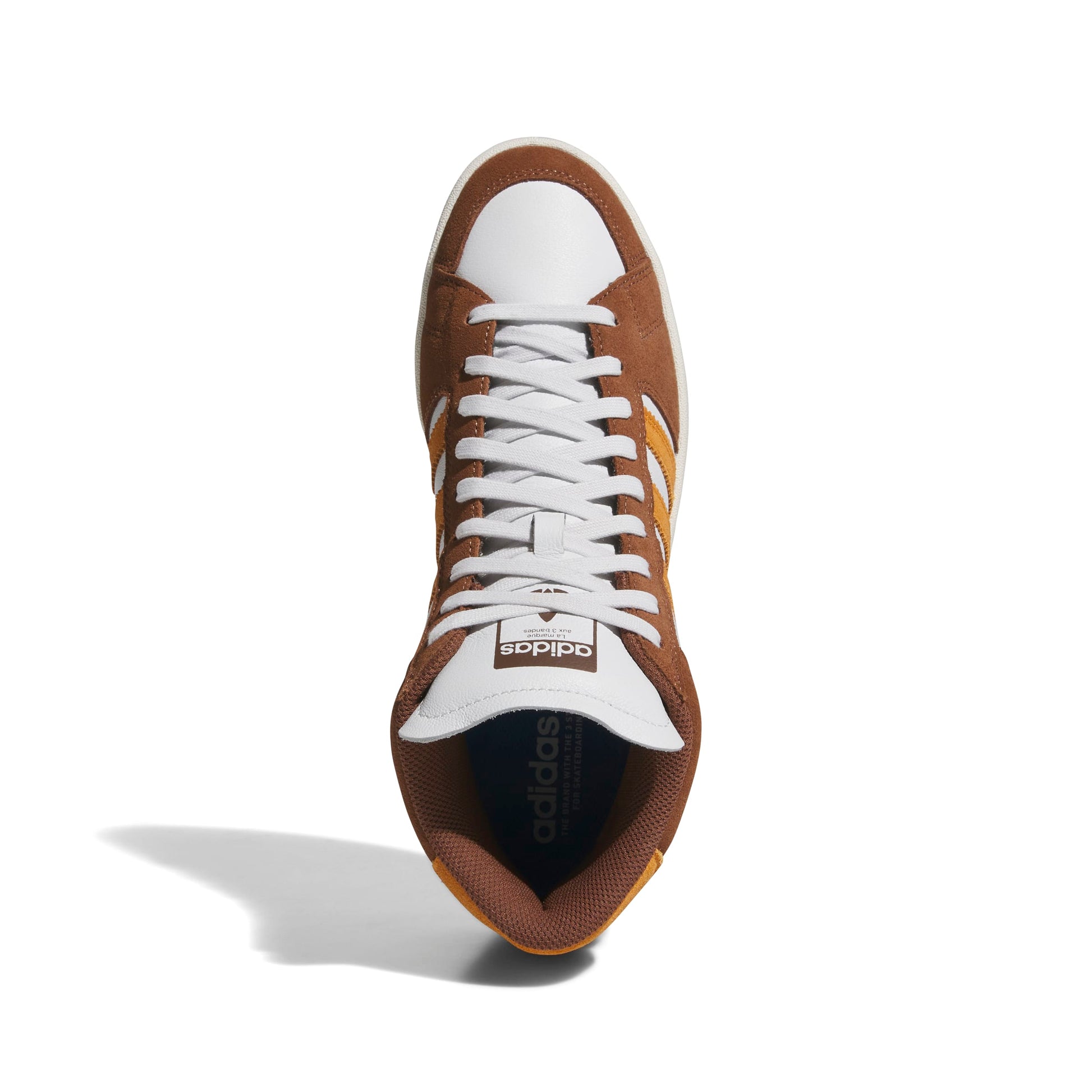 Brown and white Adidas sneaker on a white background
