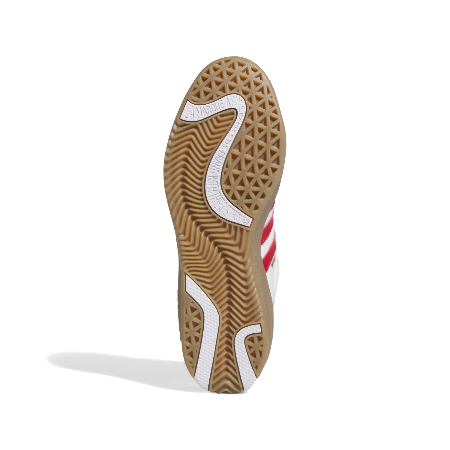 view of brown gum rubber outsole on lowtop adidas skateboard shoe
