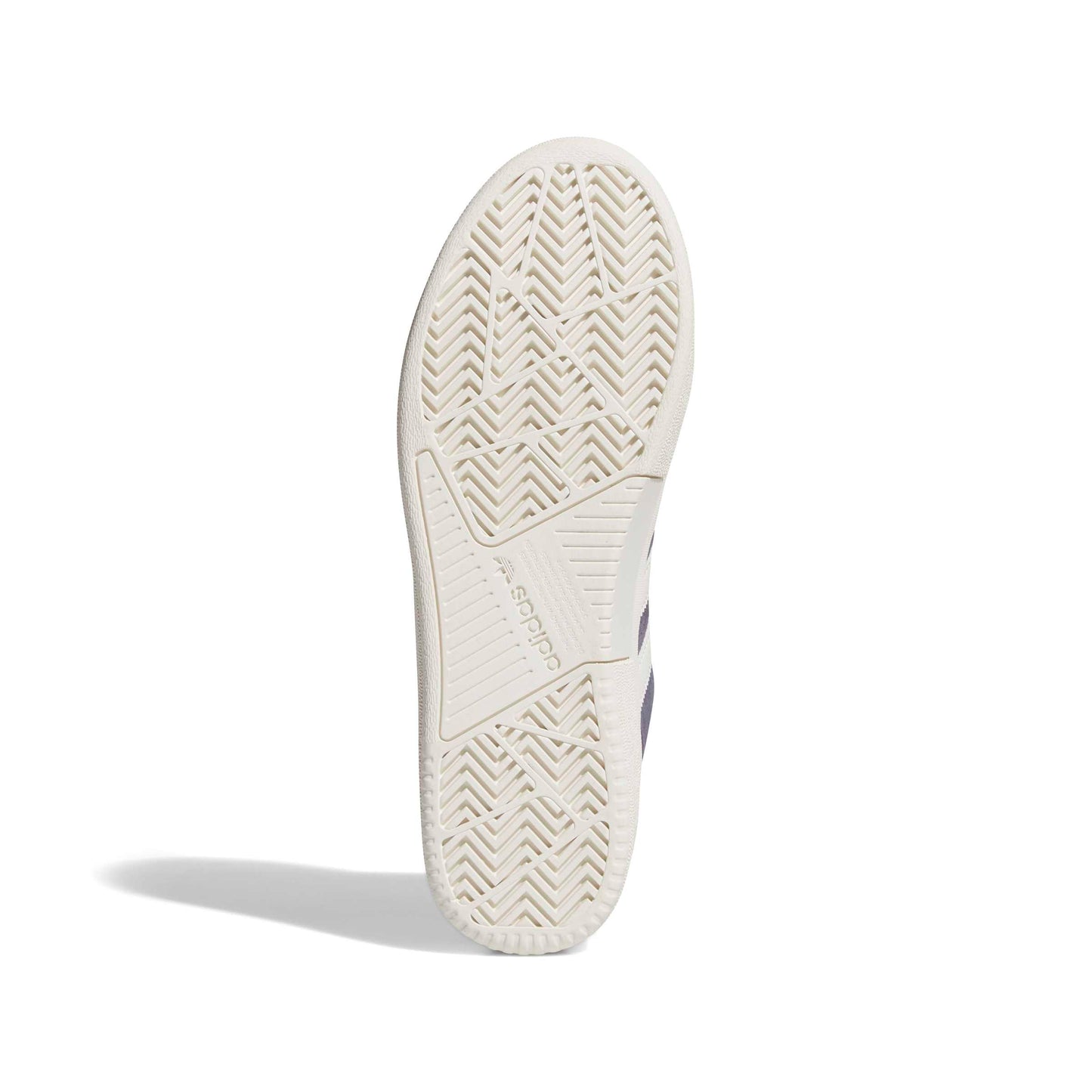Close-up of a white sneaker sole with tread pattern on a white background