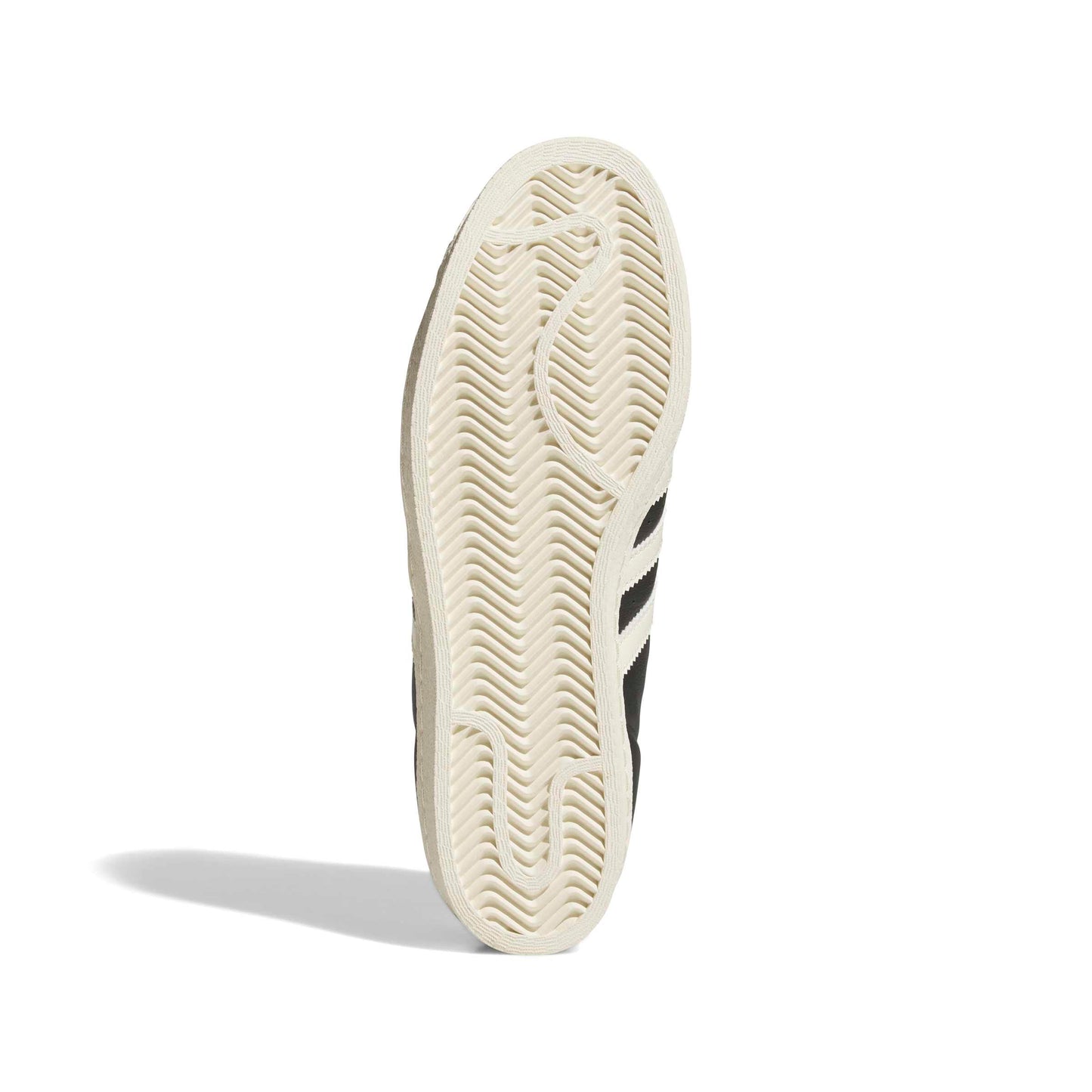 Close-up of a sneaker sole with brand logo on a white background