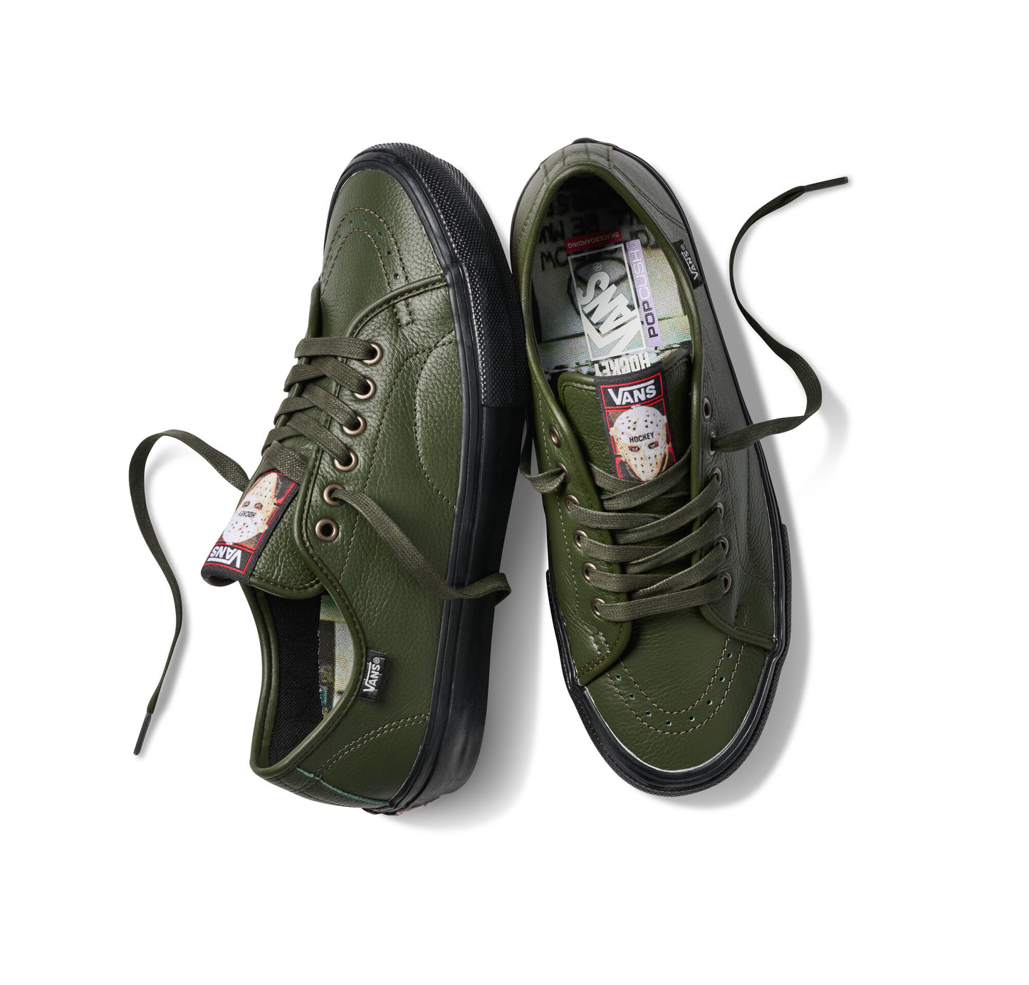 Pair of green sneakers with black soles on a white background