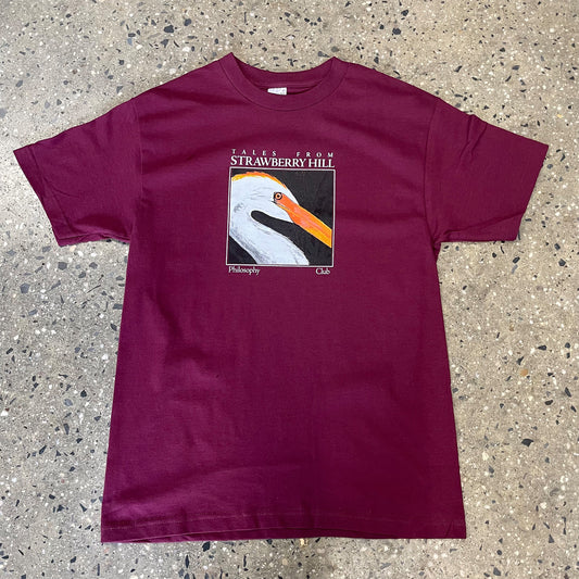 swan logo printed on a burgundy color t-shirt
