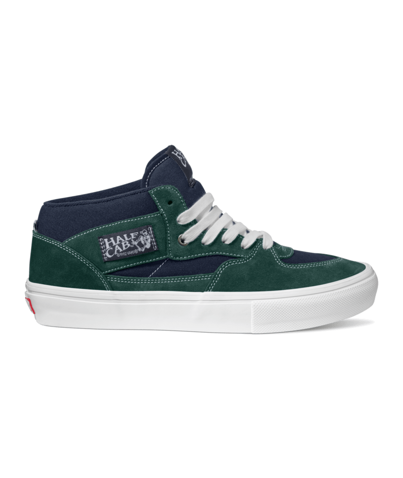 side view of blue and green suede alf cab skateboard shoe