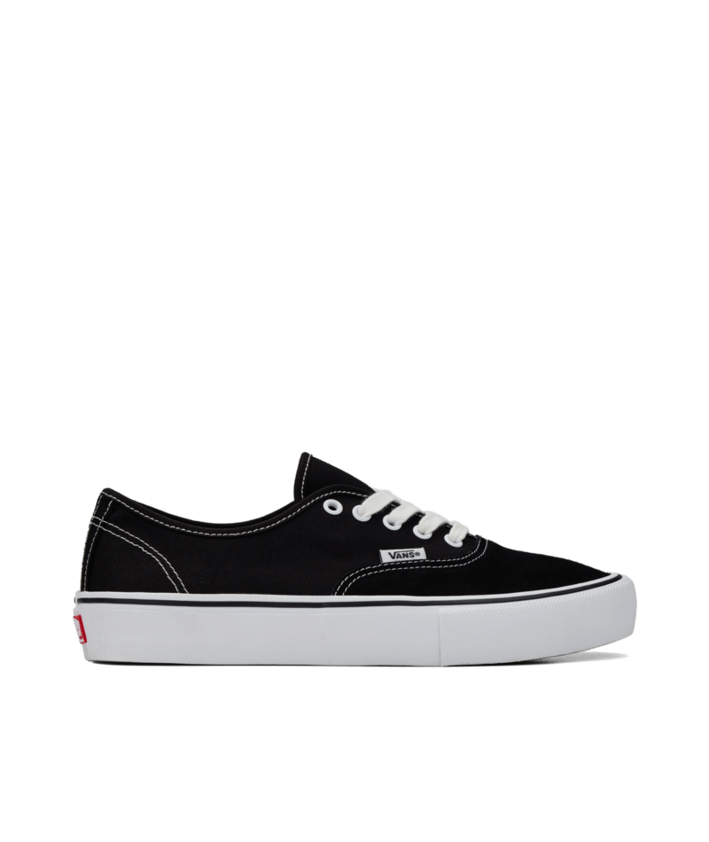 Side view of black suede and canvas lowtop skateboard sneaker with white sole