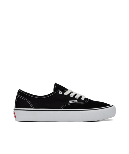 Side view of black suede and canvas lowtop skateboard sneaker with white sole