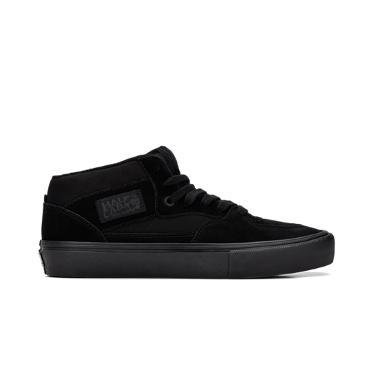 Side view of all black half cab skateboard shoe