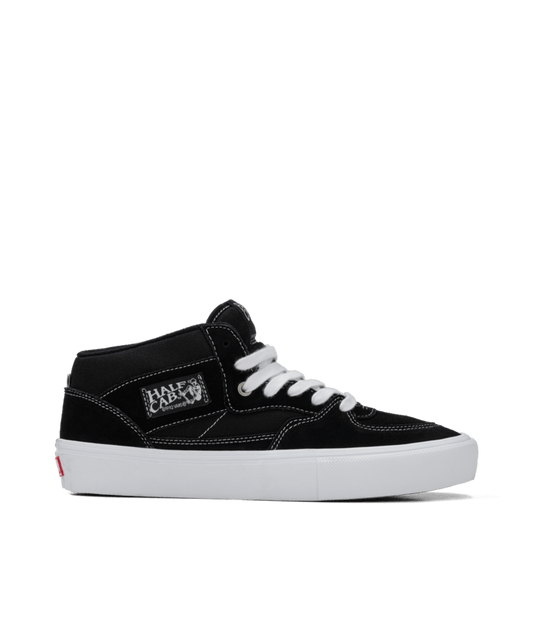 side view of black/white half cab sneaker in black suede with white sole