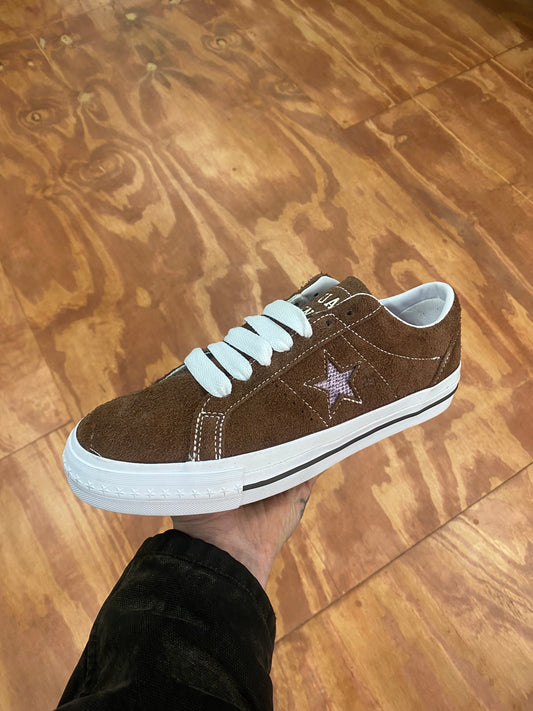 brown suede sneaker with white star, sole, and stitch