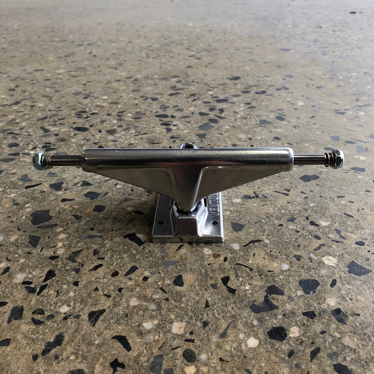 Polished silver venture skateboard truck, front view of hanger