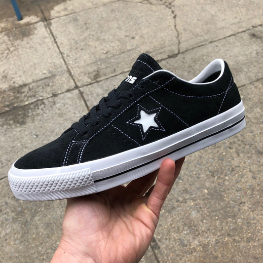 black suede sneaker with white star, sole, and stitch