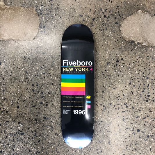 black skateboard with rainbow color graphic and text
