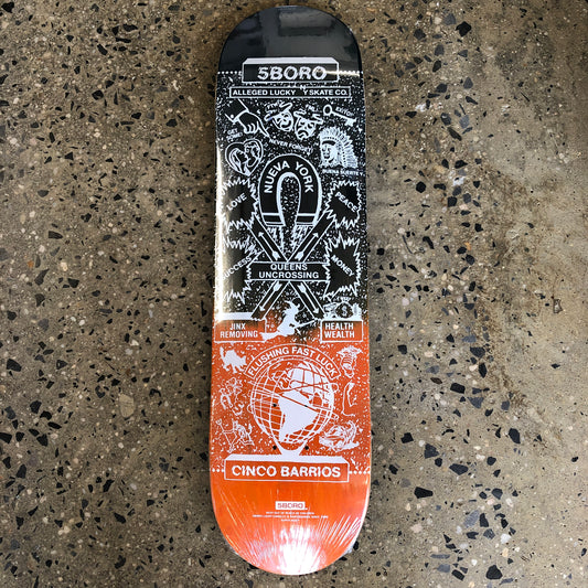 blue and orange skateboard with white drawings and text all over 