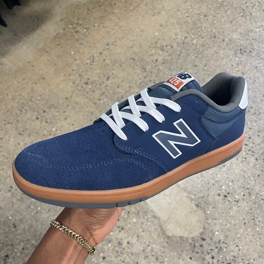 navy suede sneaker with gum sole