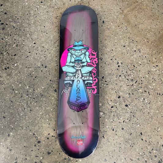 light blue monkey with hat, skull, and cross on pink, wood grain, and black skate deck