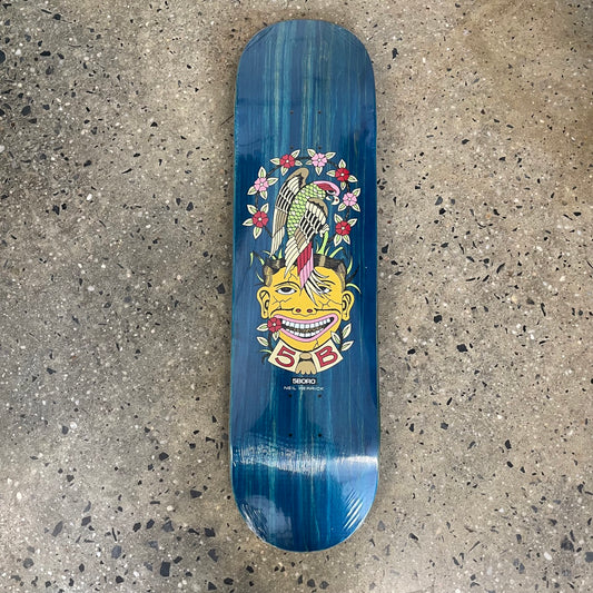 blue skateboard with a bird and man's face graphic