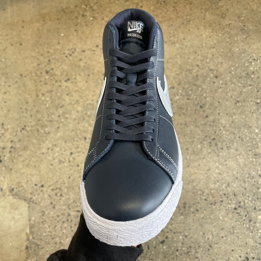 top down view of dark navy shoe, navy laces, white sole