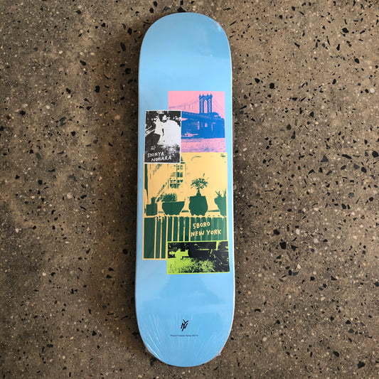 blue skateboard with a photo collage in the middle and small black text