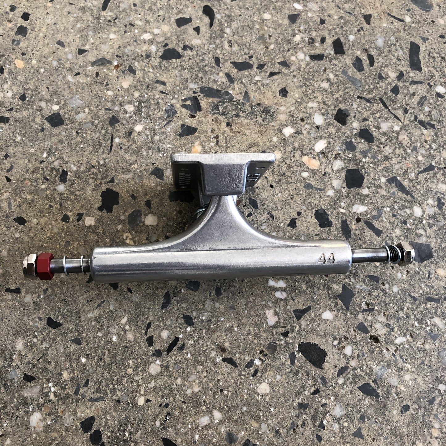 polished silver Ace skateboard trucks closeup