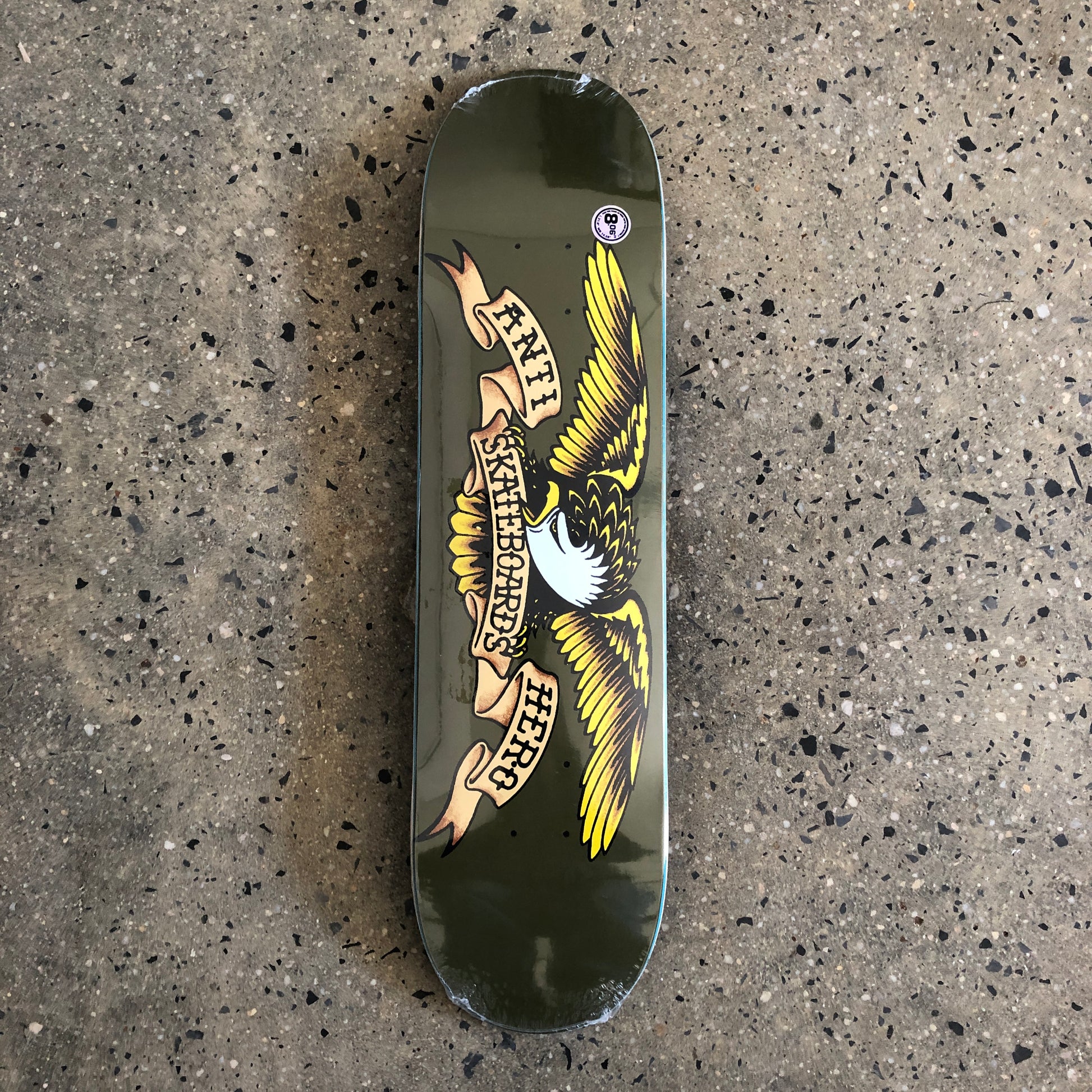 Eagle with spread wings on brown skate deck