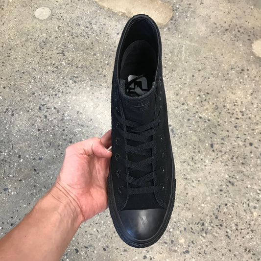 black hi top sneaker with black sole, top view