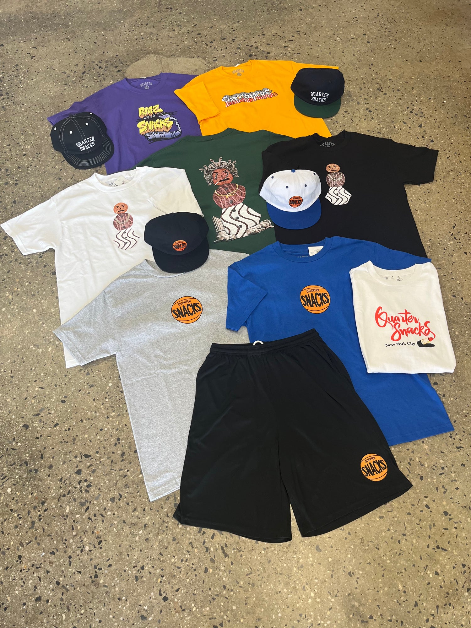 assorted quartersnacks tees, hats, and shorts