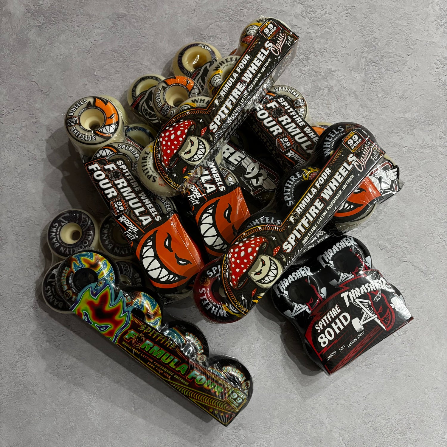 assorted spitfire wheels on a grey background