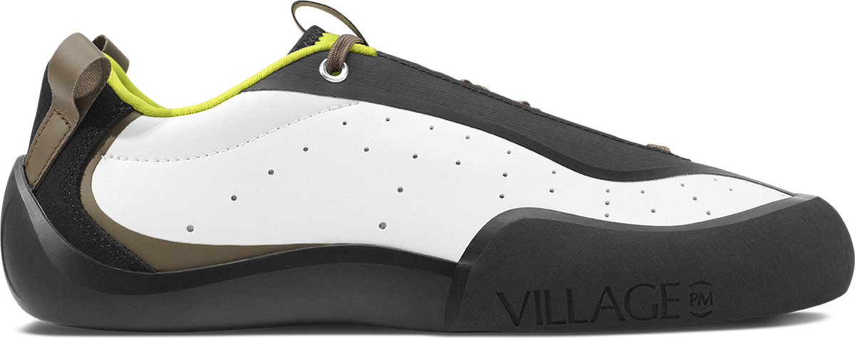 side profile view of white and black leather climbing style skateboard shoe