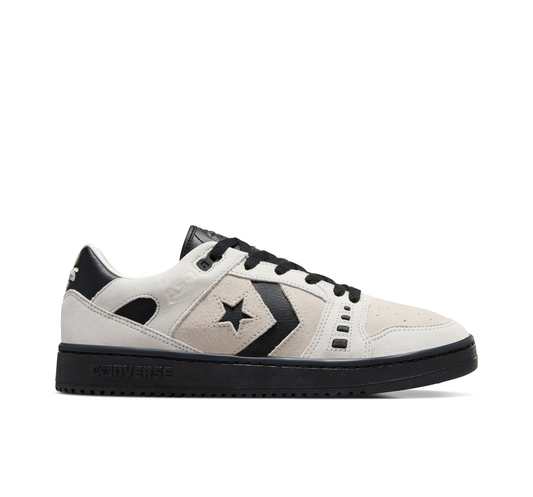 side view of white/black suede low top sneaker with black sole
