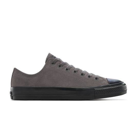 Gray sneaker with black sole on a white background
