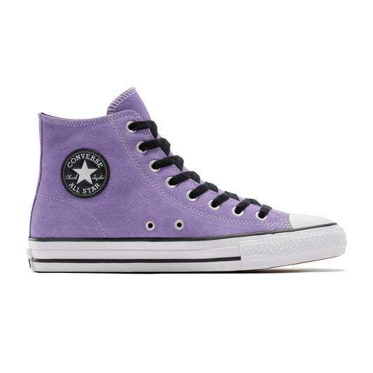 side view of light purple suede mid top shoe, with white sole, black laces and white sole, all against a white background