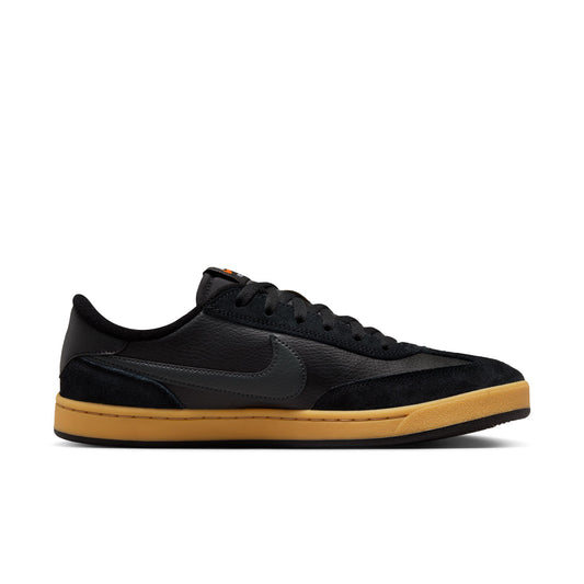 side view of black suede and leather lowtop sneaker with gum sole