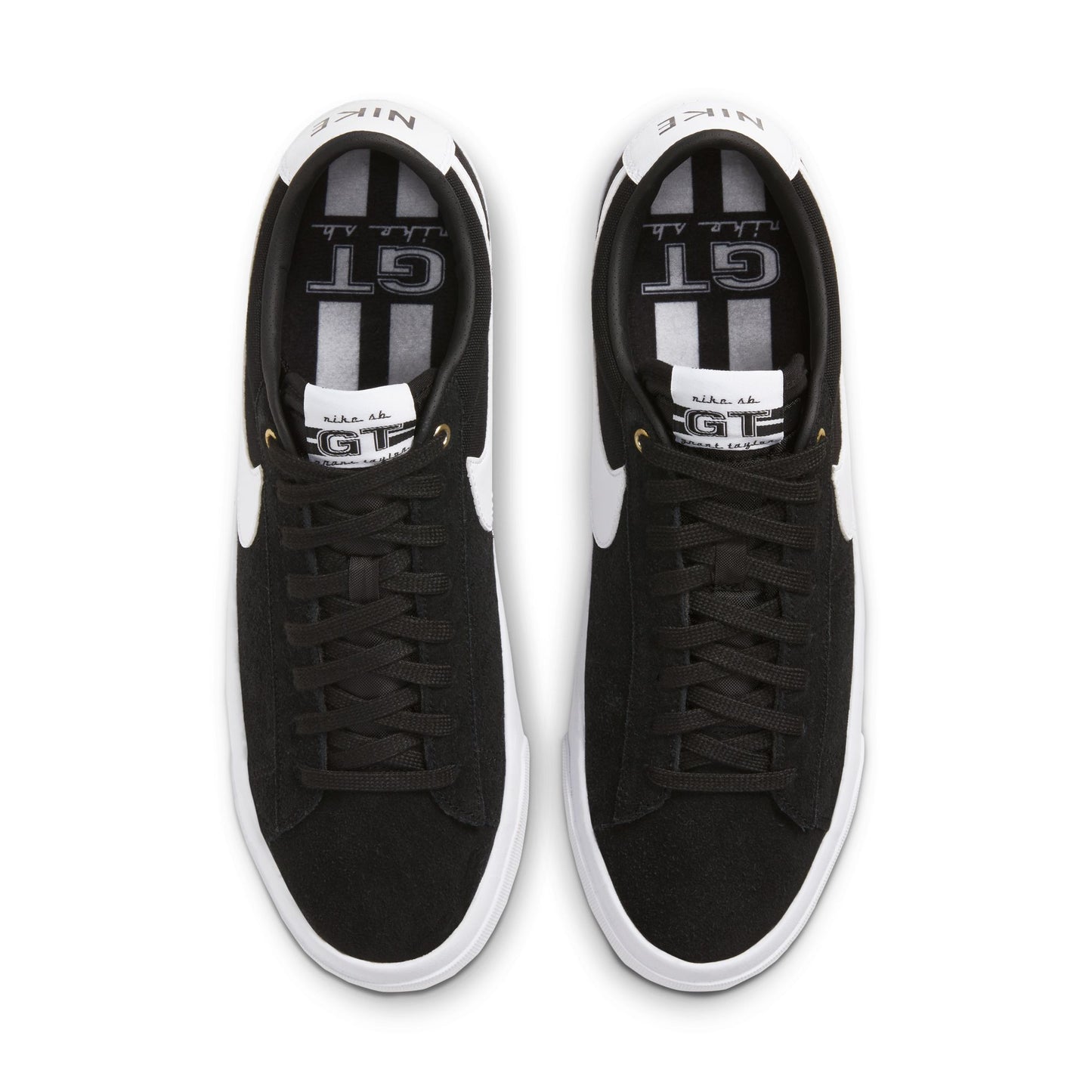 overhead view of Black sneakers with white soles on a white background