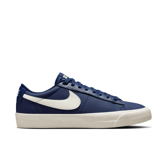 Blue sneaker with a white logo on a white background