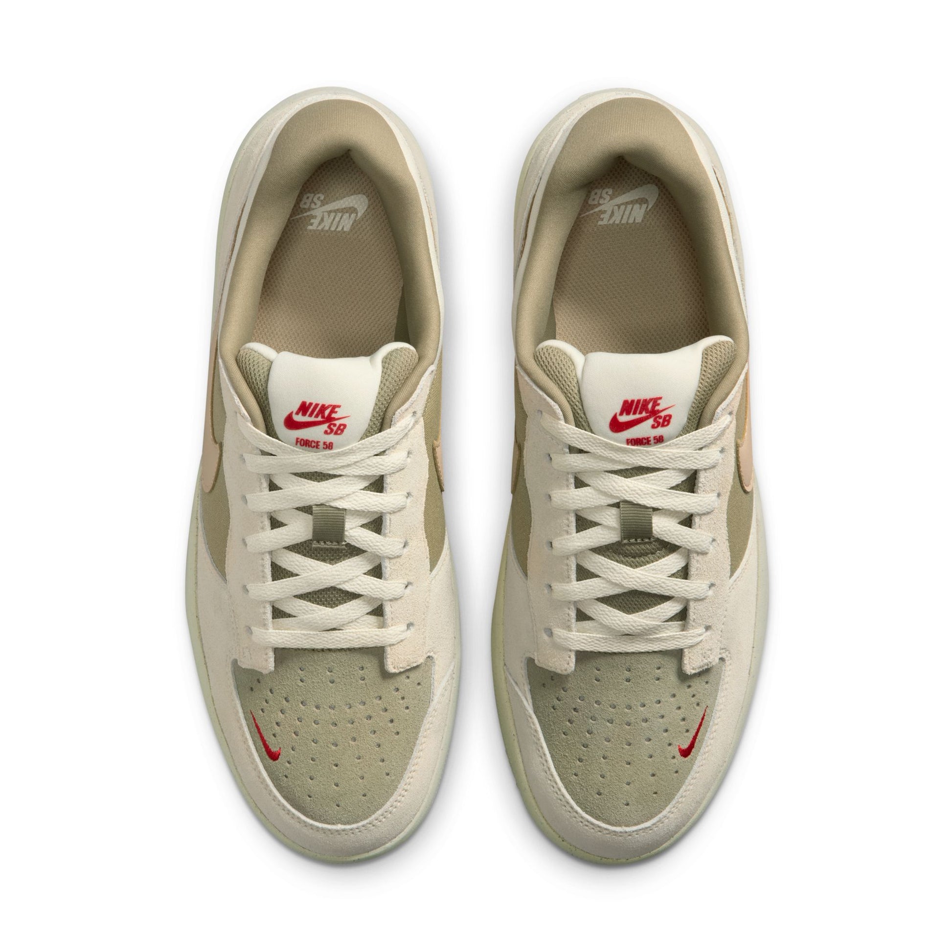 Pair of beige sneakers with red accents on a white background