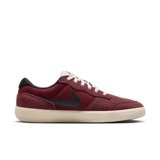 side view of dark red suede and nylon skateboard shoe with black swoosh, and off white outsole