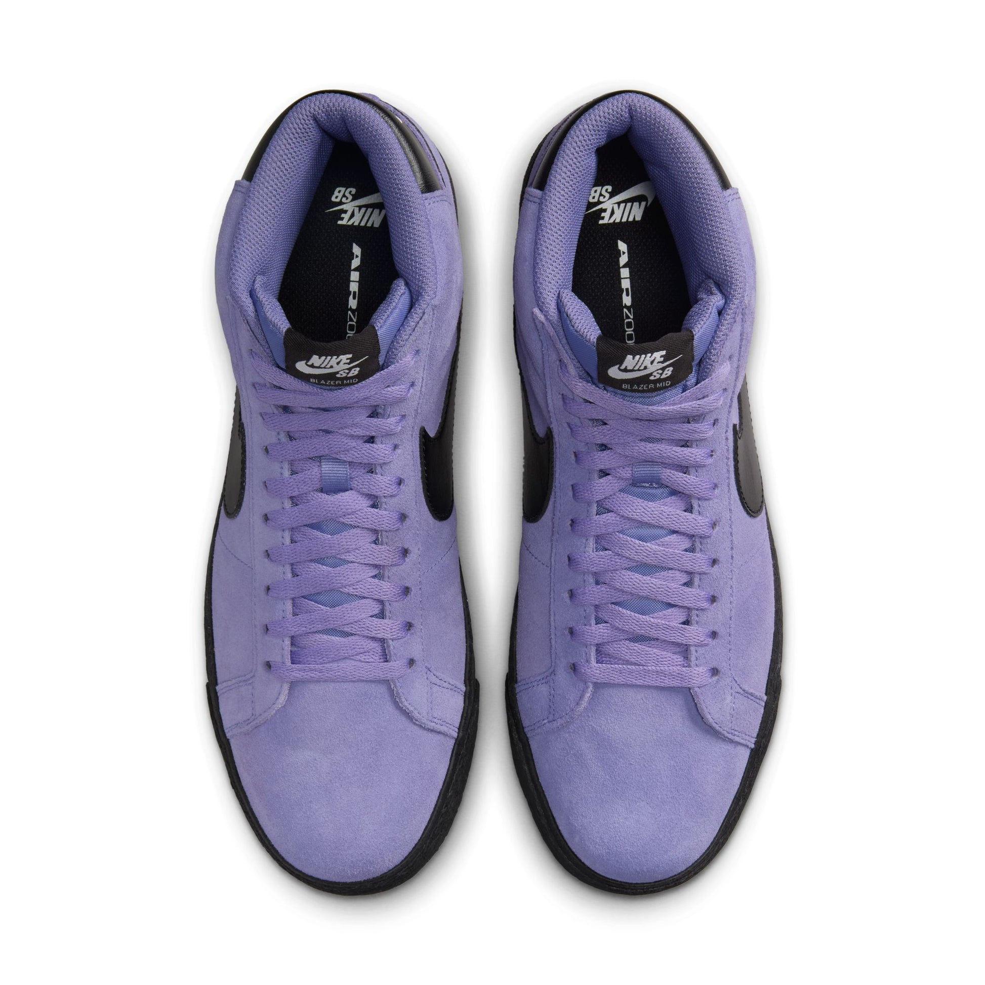 top down view of light purple mid top suede skateboard sneakers with black sole