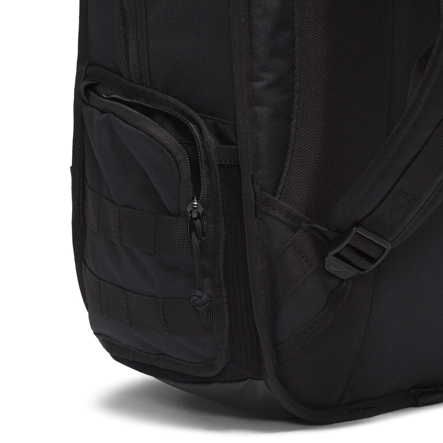 Close-up of a black backpack with multiple pockets and straps on a white background
