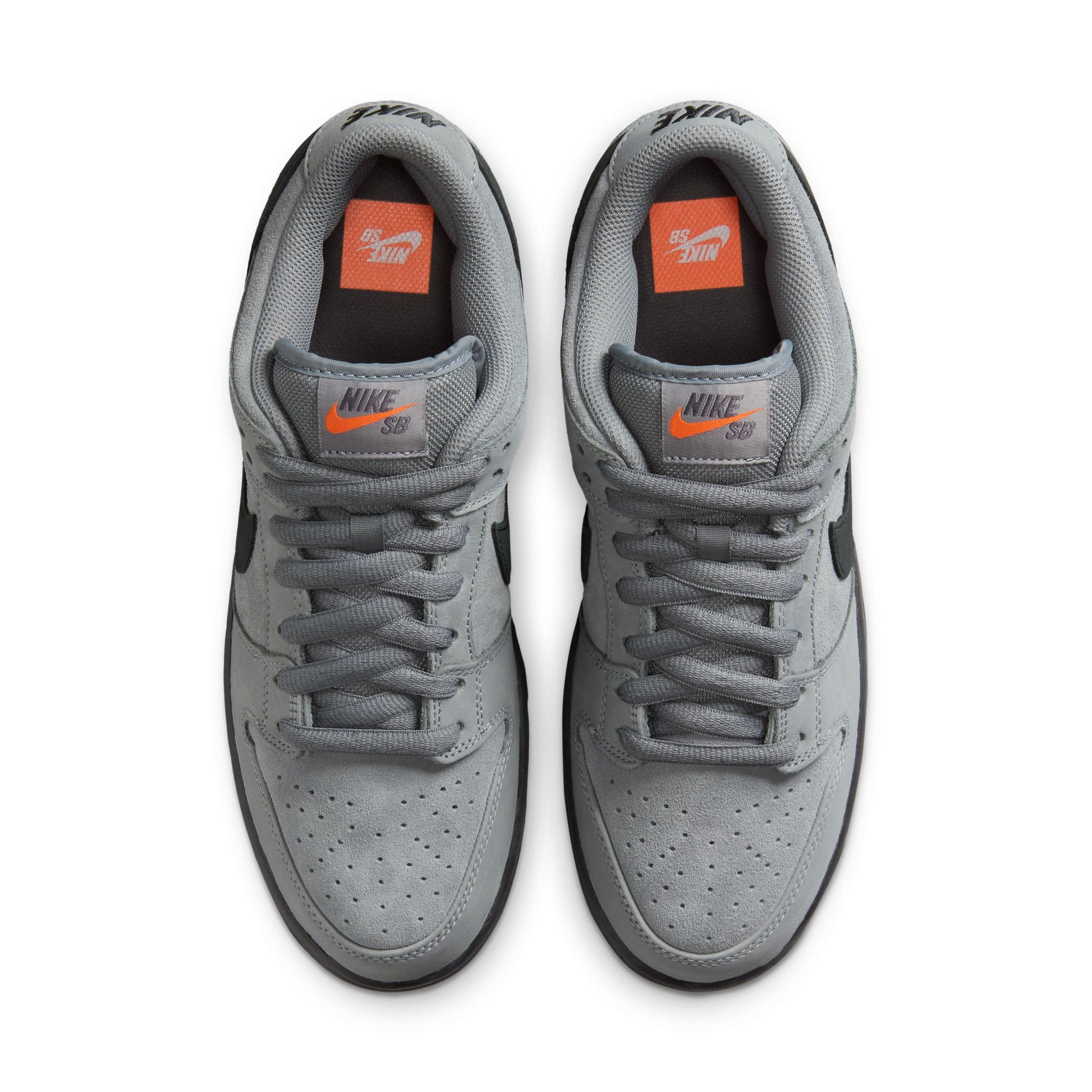 Gray sneakers with orange accents on a white background