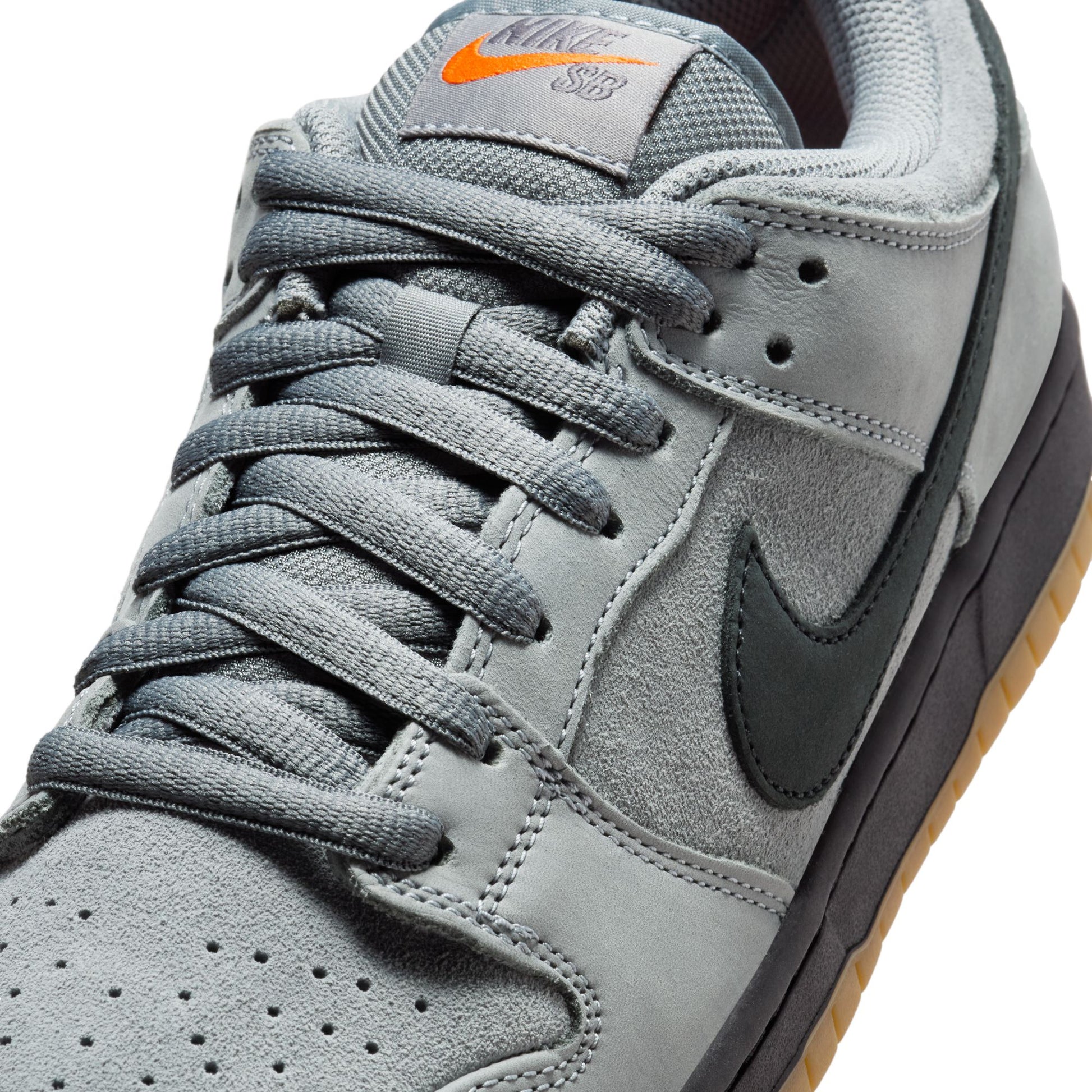 Gray sneaker with black swoosh logo on a white background
