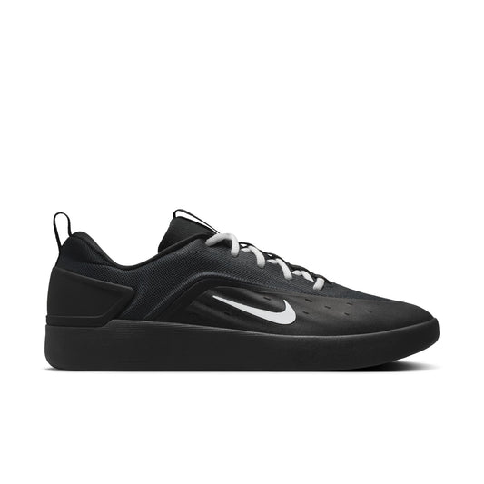 Black sneaker with a white Nike logo on a white background