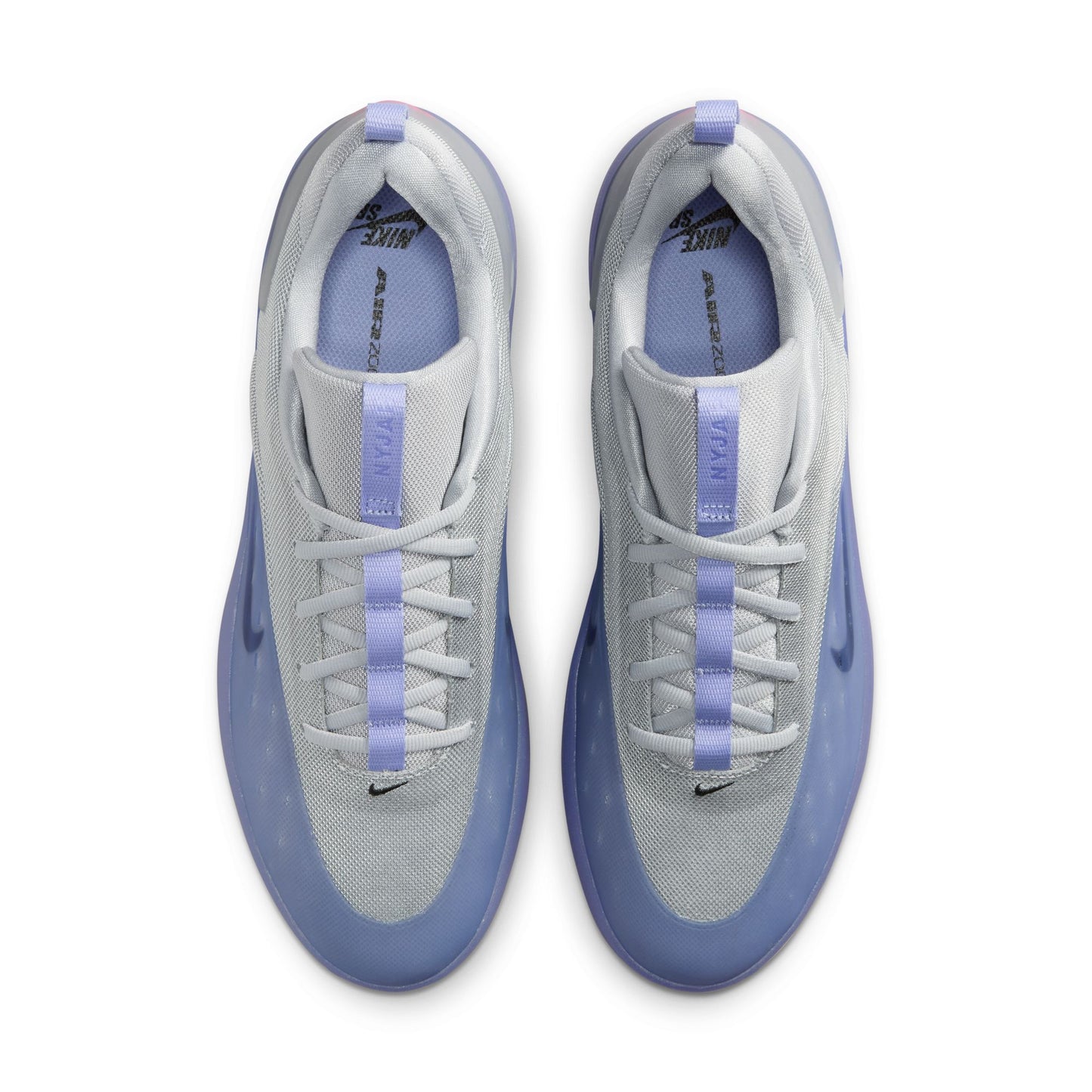 Gray sneakers with purple accents on a white background