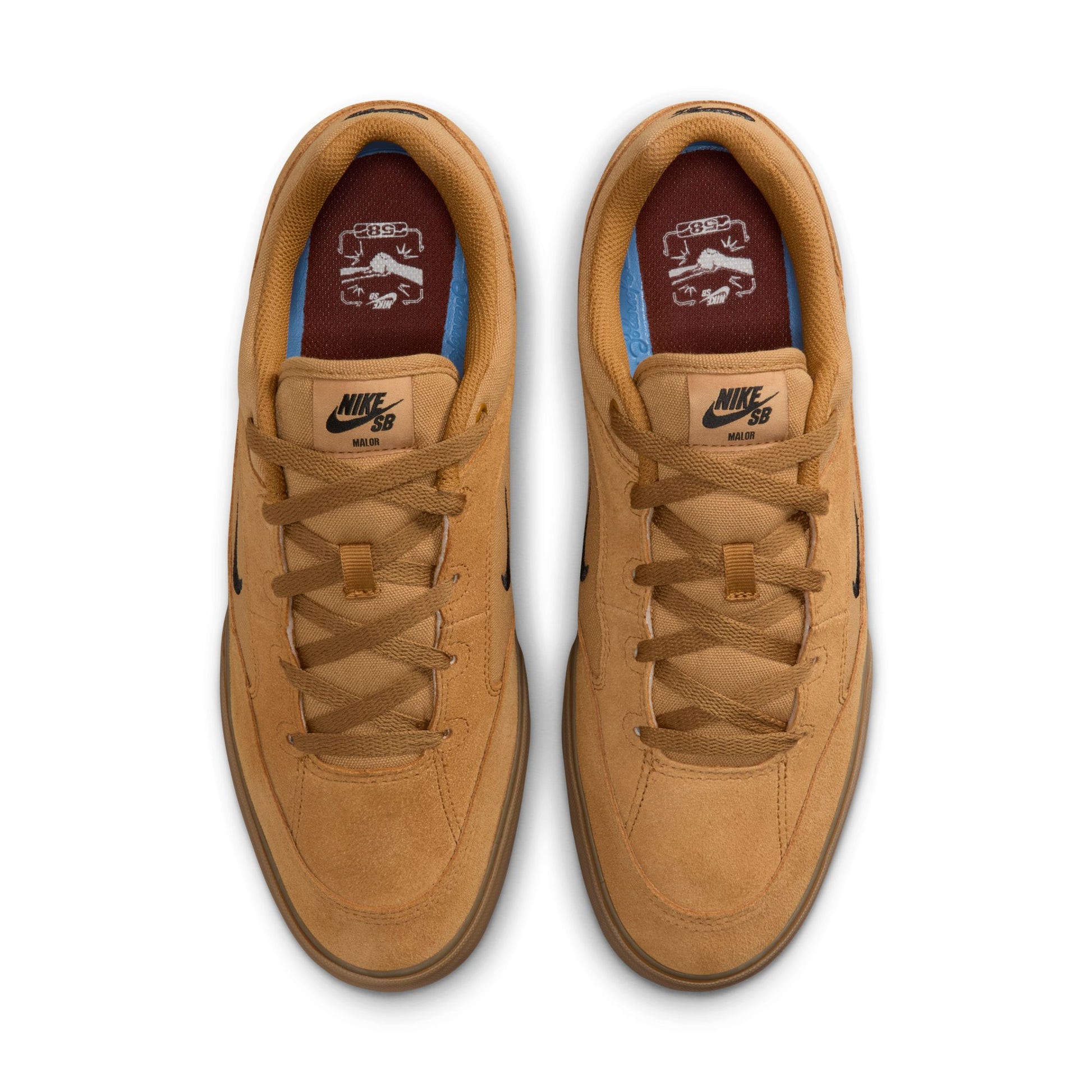 Pair of tan sneakers with Nike logo on a white background