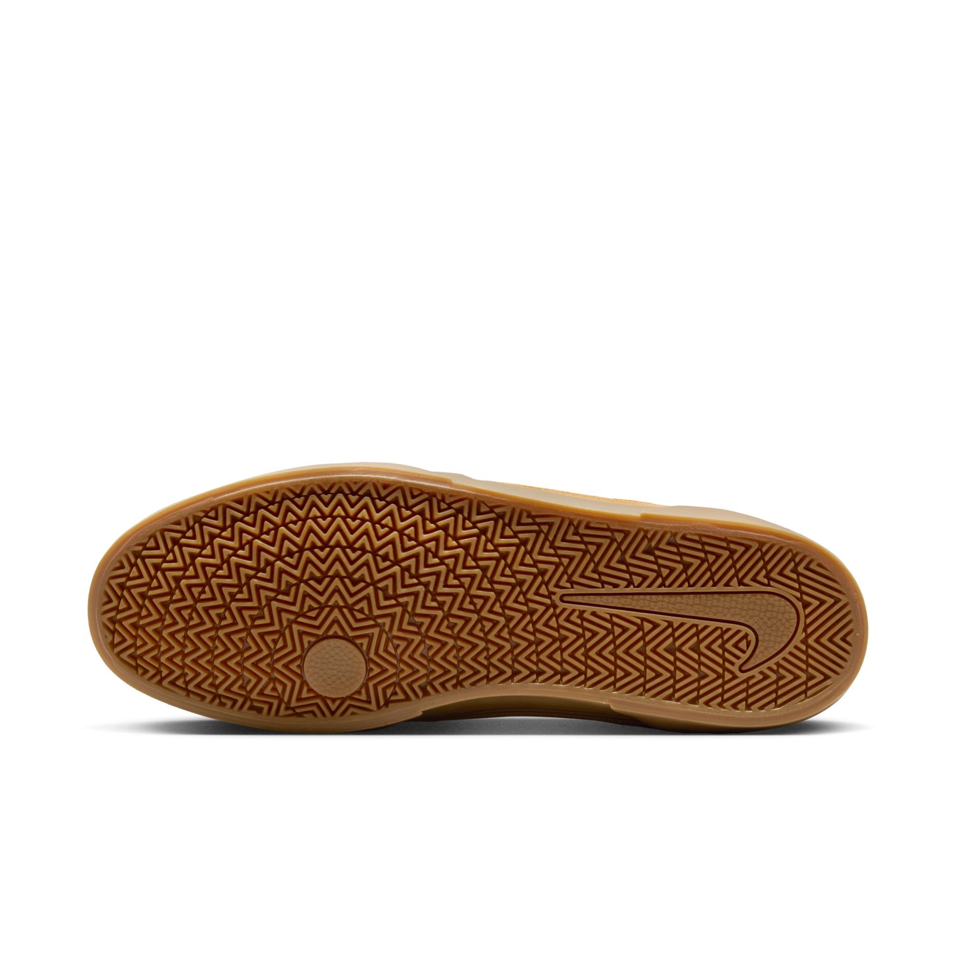 Brown shoe sole with a textured pattern on a white background