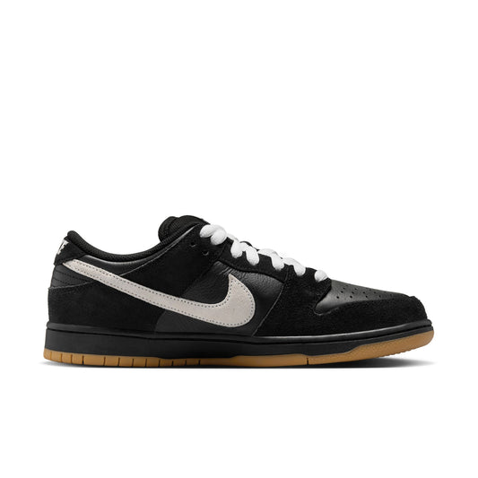 side view of black leather and suede low top skateboard shoe with black and gum sole
