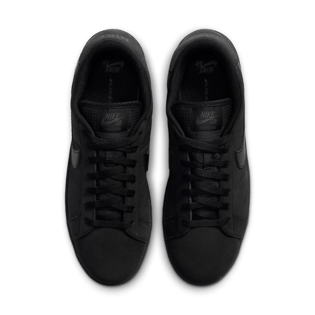 A pair of Nike SB low-top sneakers in all black, shown from a top-down view on a white background.